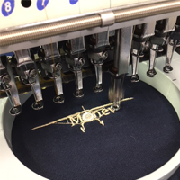 Navy polo shirt being embroidered with company logo